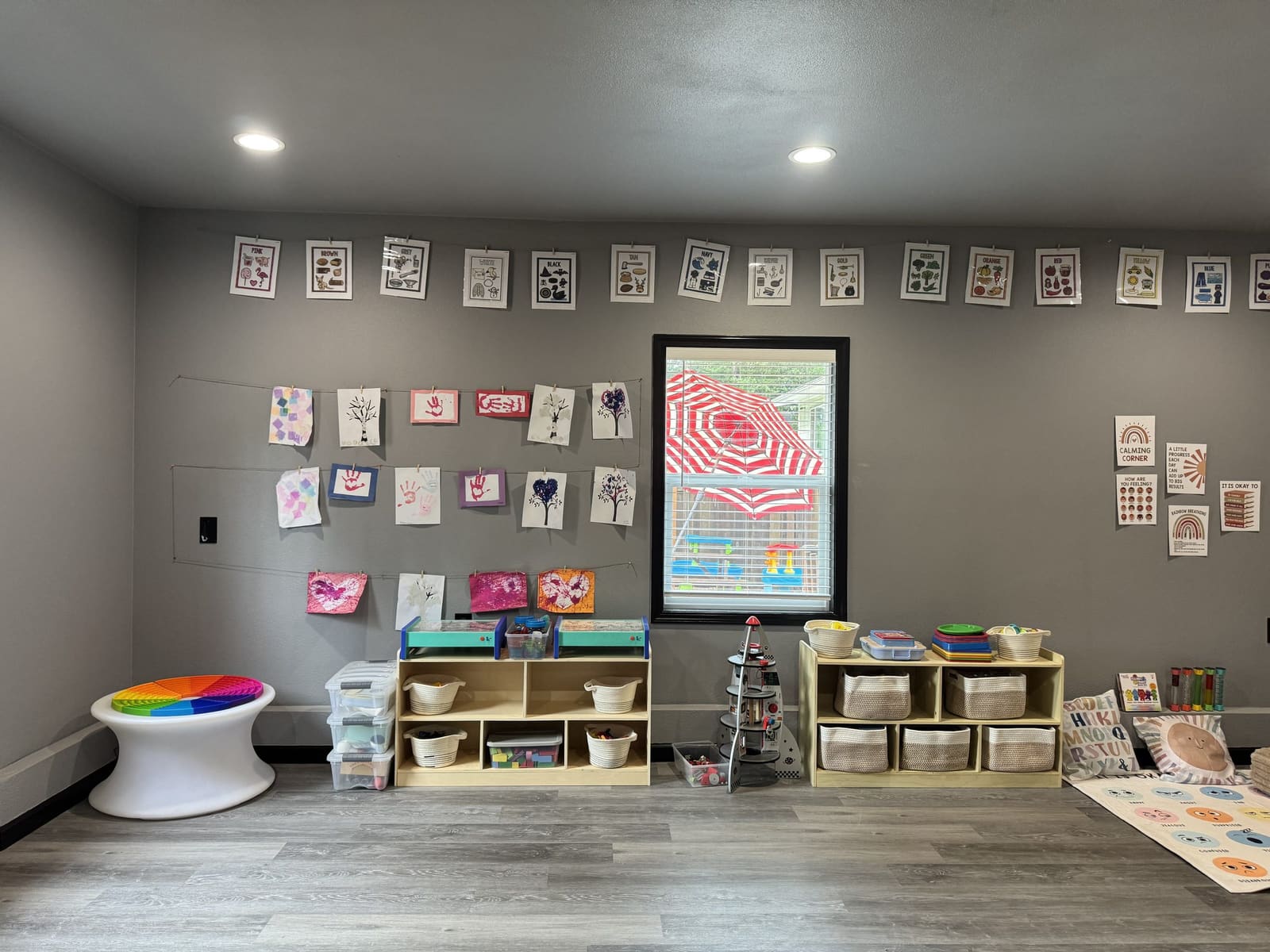 Classroom learning area with toys and activity bins